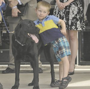 Two bill signings mark dog day at the Legislature